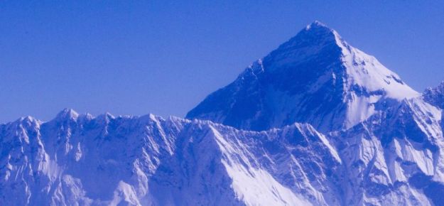 epa03866778 A general view of the 8,848 m (29,028 feet) high Mount Everest taken from an aircraft over Nepal, 14 September 2013. The domestic Nepalese carrier Yeti Airline took a total 18 orphan children from Bal Mandir orphanage home to show an aerial view of Mount Everest and Himalayan mountain range to celebrate National Children's Day.  EPA/NARENDRA SHRESTHA